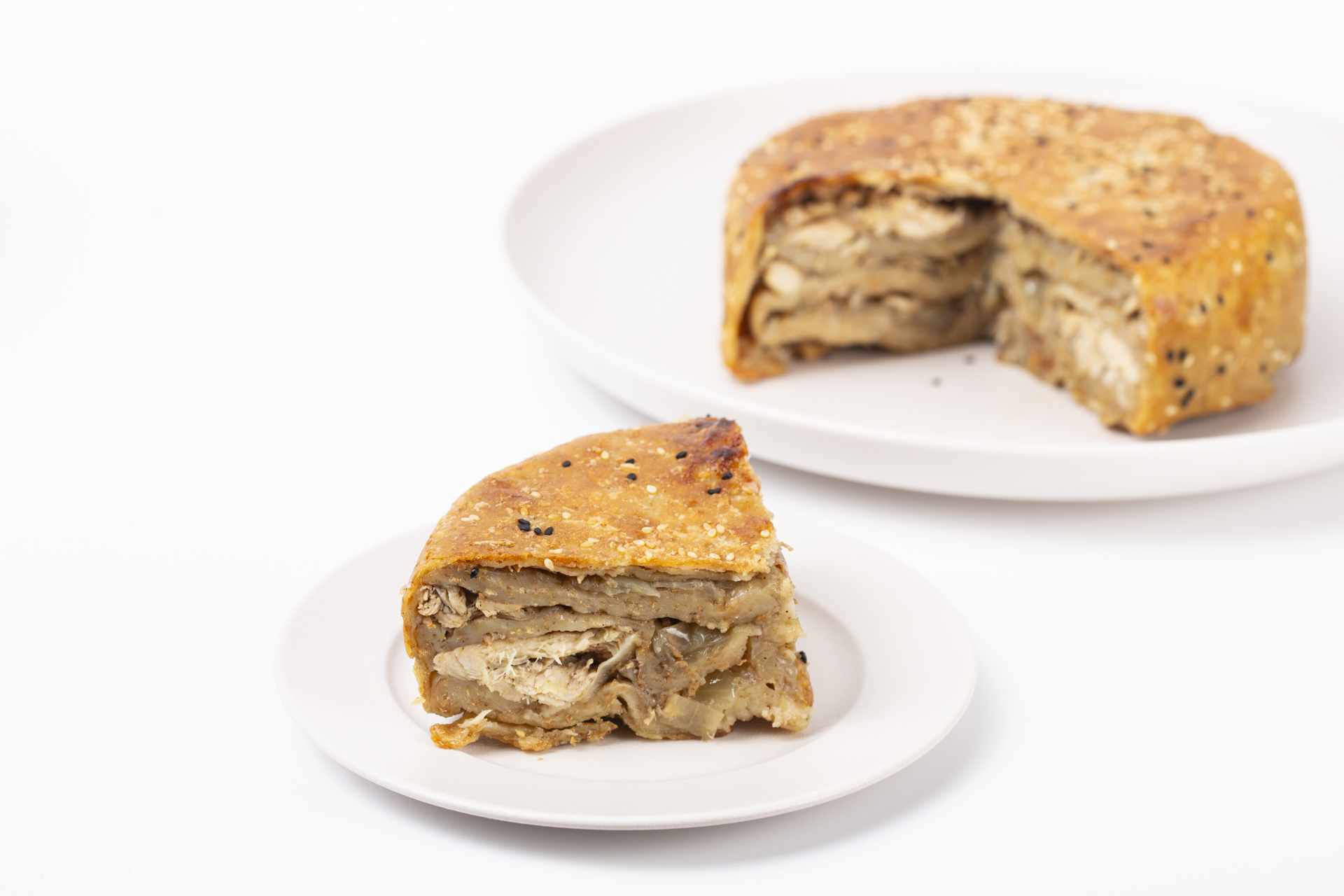 Jordanian Makmoora traditional chicken and caramelized onion pie served at Sakbeh Dubai